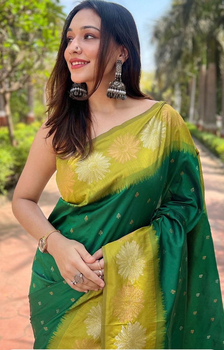 Golden green ombre soft silk Banarasi art silk saree with woven floral designs.